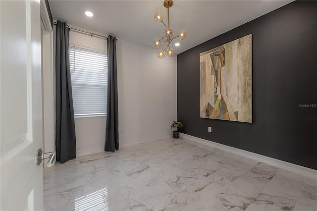 unfurnished room featuring a notable chandelier