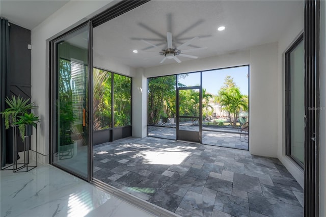 interior space featuring ceiling fan