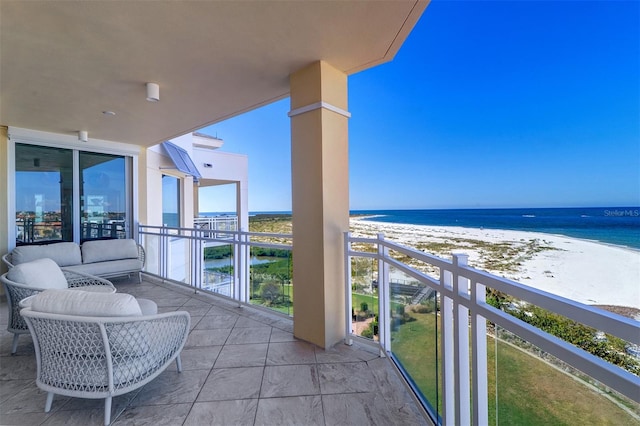 balcony with a beach view and a water view