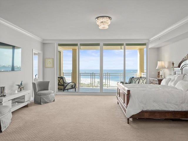 carpeted bedroom with multiple windows, a water view, a view of the beach, and ornamental molding