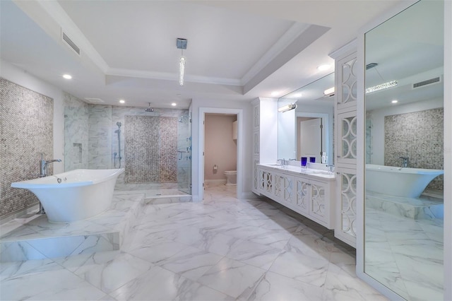 full bathroom with a raised ceiling, crown molding, toilet, vanity, and independent shower and bath