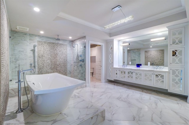 bathroom featuring crown molding, vanity, and independent shower and bath