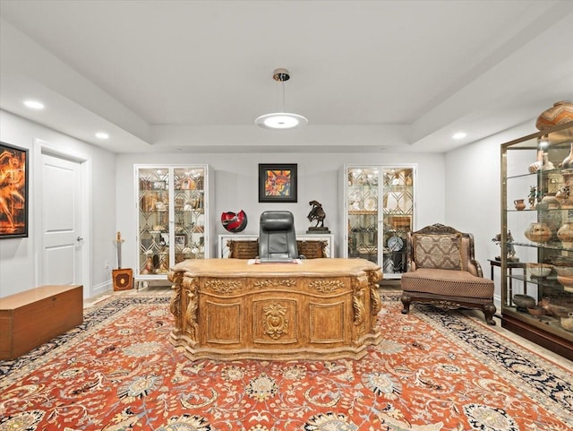 office featuring a tray ceiling