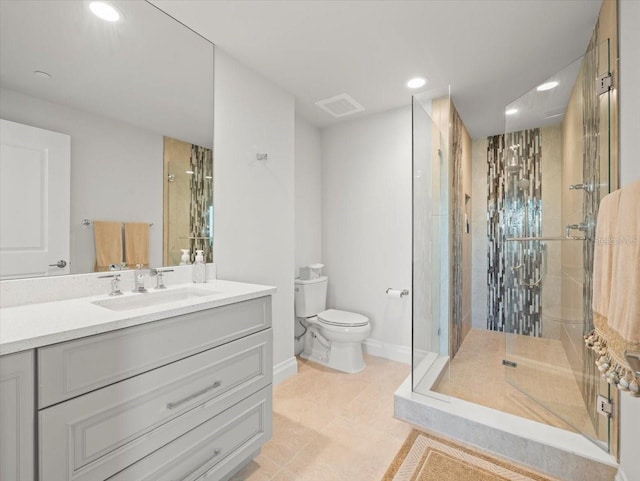 bathroom featuring vanity, toilet, and a shower with shower door