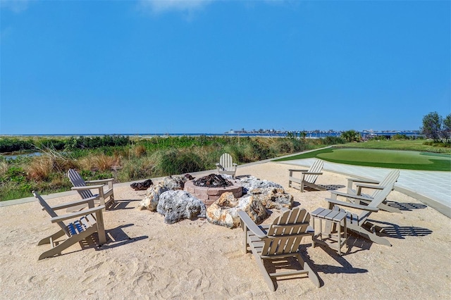 view of patio / terrace featuring an outdoor fire pit