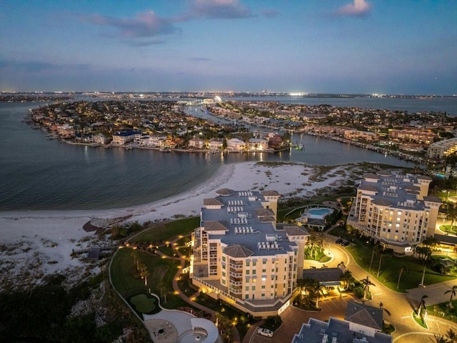 aerial view at dusk with a water view