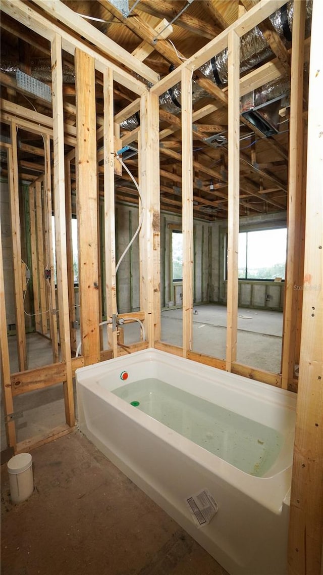 bathroom featuring a tub to relax in