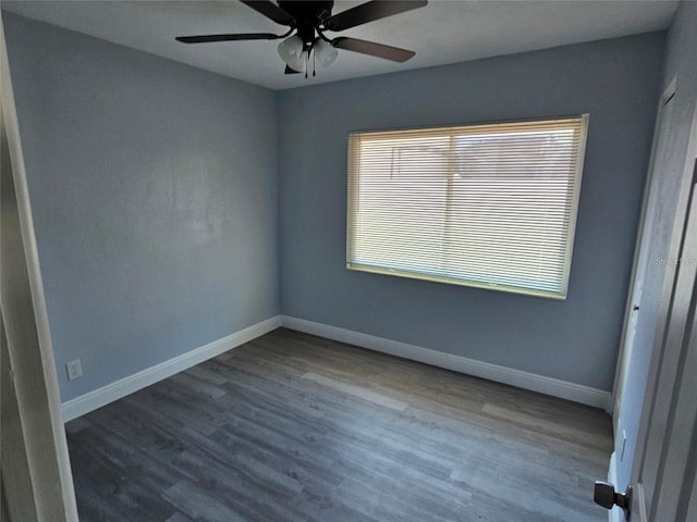 empty room featuring hardwood / wood-style flooring and ceiling fan