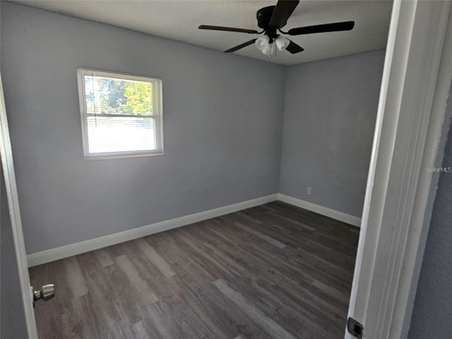 unfurnished room featuring dark hardwood / wood-style floors and ceiling fan