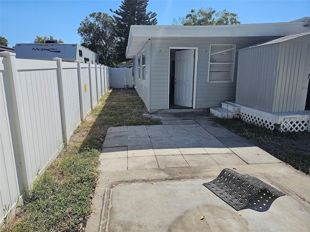 property entrance featuring a patio