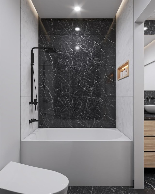 full bathroom featuring toilet, shower / washtub combination, vanity, and tile walls