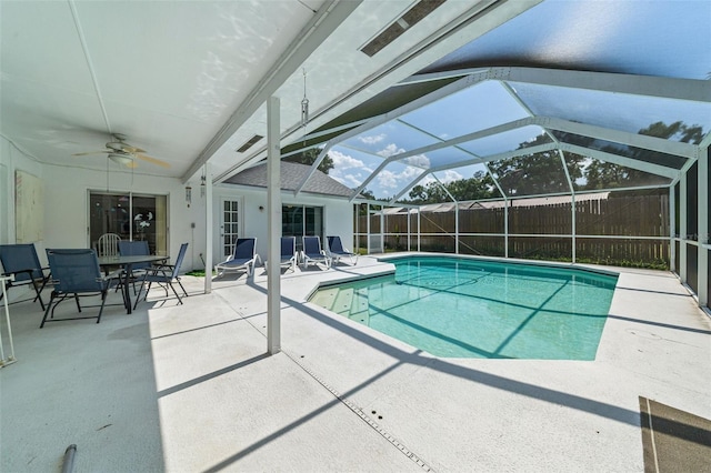 view of swimming pool with a fenced in pool, a patio area, ceiling fan, fence, and a lanai