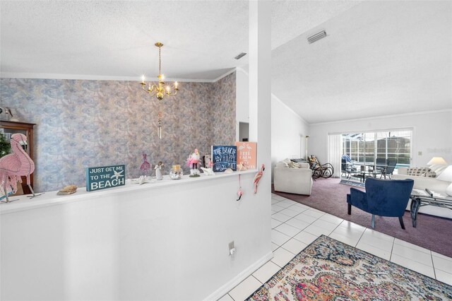 interior space featuring a textured ceiling, visible vents, and crown molding