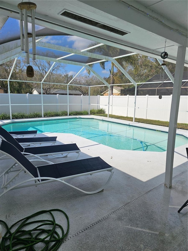 view of swimming pool with fence private yard and a fenced in pool