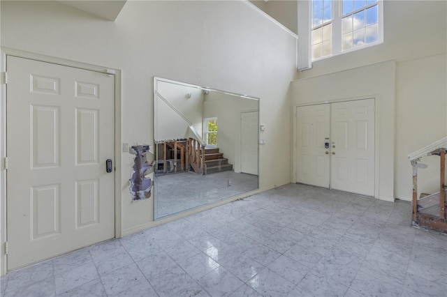 entrance foyer with a high ceiling and a wealth of natural light