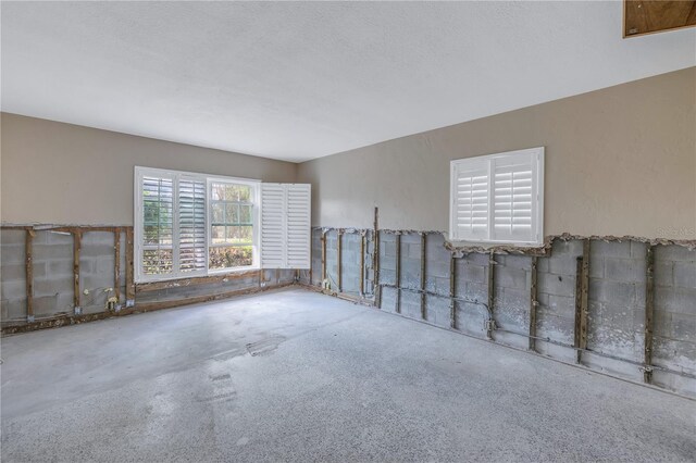 empty room featuring a textured ceiling