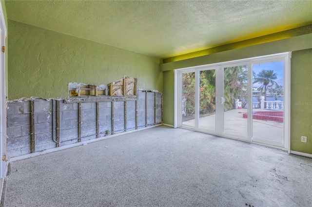 empty room with a textured ceiling