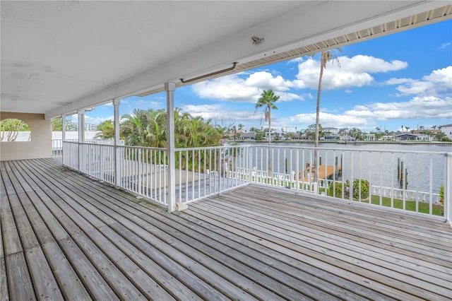 wooden deck featuring a water view