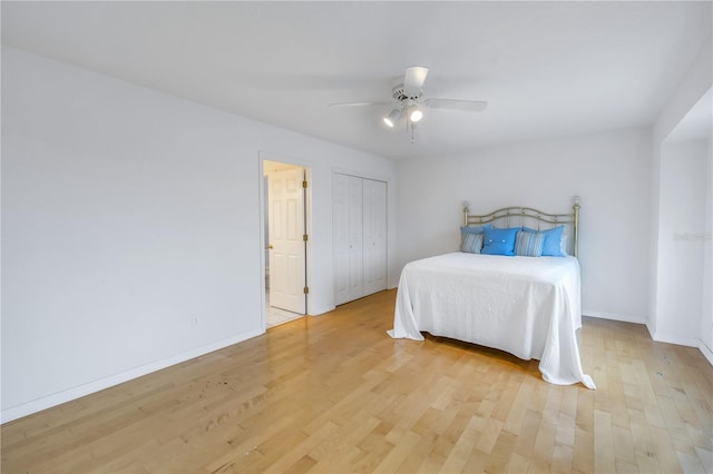 bedroom with ceiling fan and light hardwood / wood-style flooring