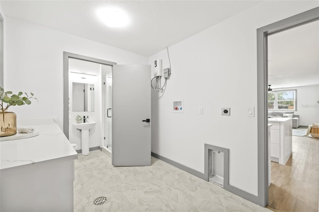 interior space featuring light hardwood / wood-style floors and a textured ceiling