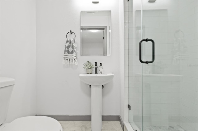 bathroom with toilet and walk in shower