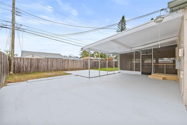 view of patio / terrace with a sunroom