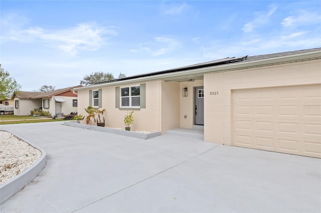 ranch-style home with a garage