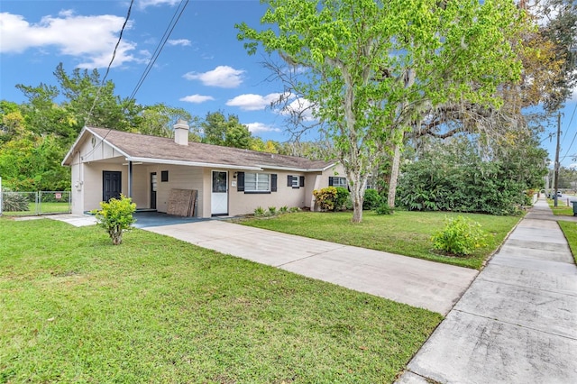 ranch-style house with a front lawn and a carport