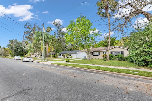 single story home with a front yard