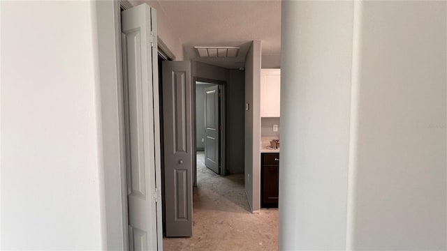 corridor with concrete flooring and visible vents