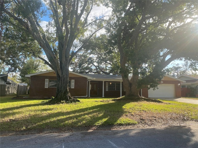 single story home with a garage and a front yard