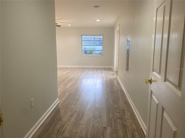 corridor featuring dark wood-type flooring