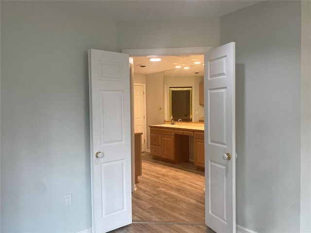 hall with light hardwood / wood-style floors