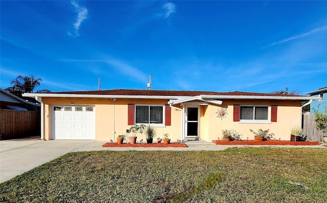 single story home featuring a front yard and a garage