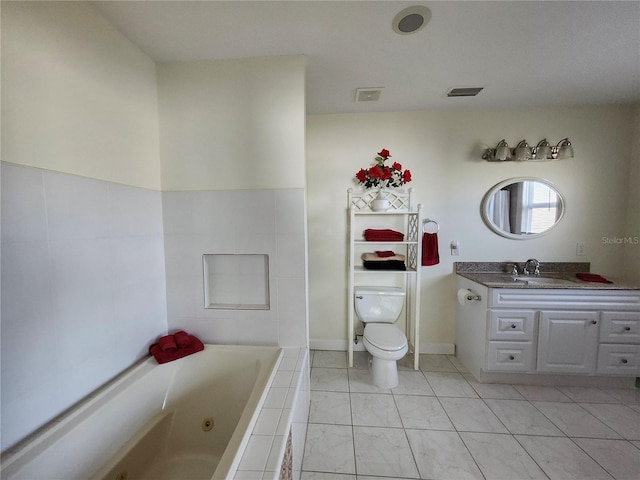 bathroom featuring tile patterned flooring, toilet, vanity, visible vents, and a tub with jets