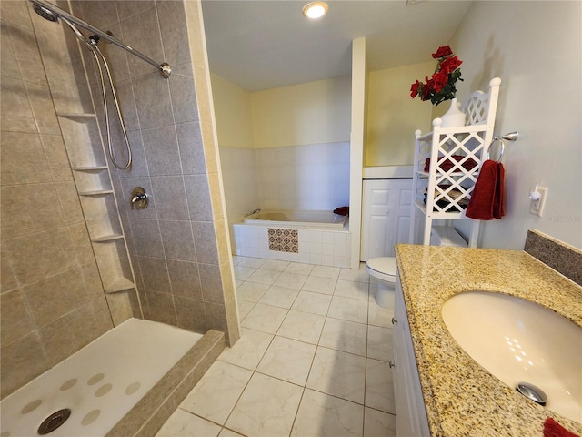 bathroom with tiled shower, vanity, and a bath