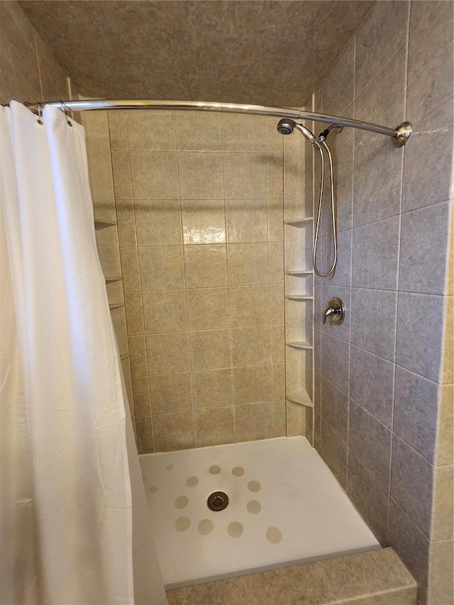 full bath featuring a stall shower