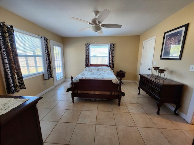 bedroom with light tile patterned floors, ceiling fan, and baseboards