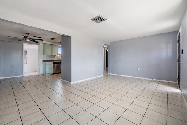 empty room with ceiling fan and light tile patterned flooring