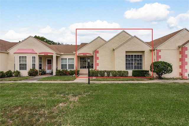 ranch-style house with a front yard