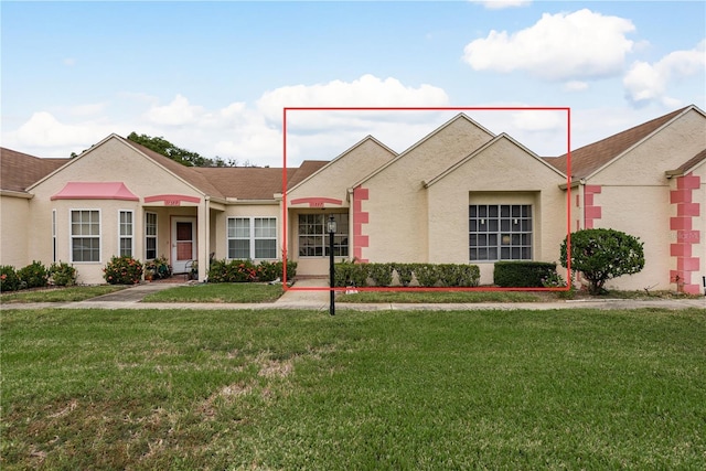 11337 Versailles Ln Unit F, Port Richey, FL 34668 - ranch-style house with a front yard