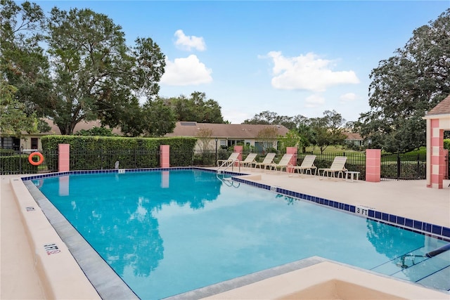 view of swimming pool with a patio area