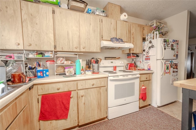 kitchen featuring a textured ceiling, light brown cabinets, light tile patterned floors, and white appliances