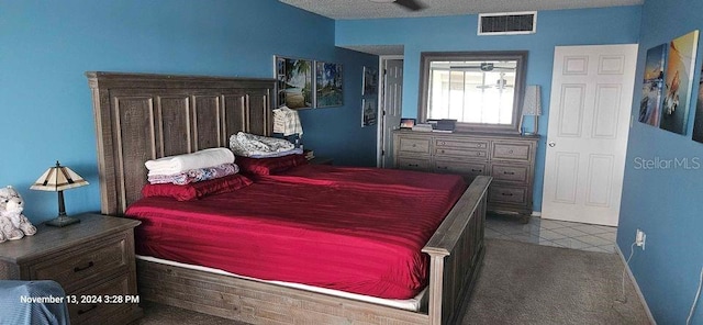 carpeted bedroom with a textured ceiling