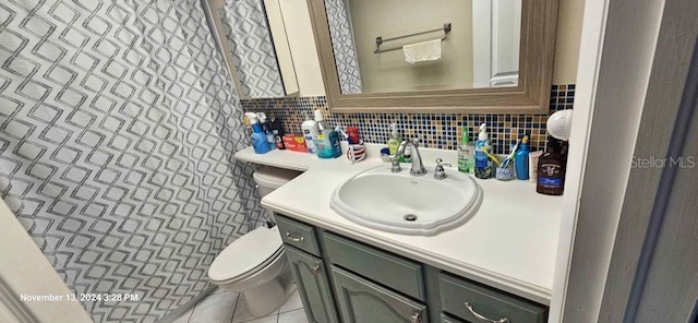17920 Gulf Blvd Unit 1508, Redington Shores, FL 33708 - bathroom featuring toilet, vanity, and backsplash