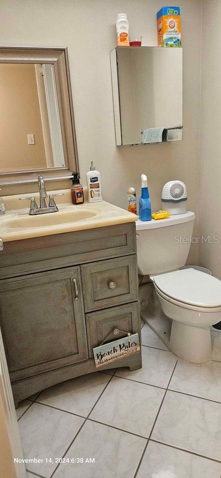 17920 Gulf Blvd Unit 1508, Redington Shores, FL 33708 - bathroom with vanity, toilet, and tile patterned floors