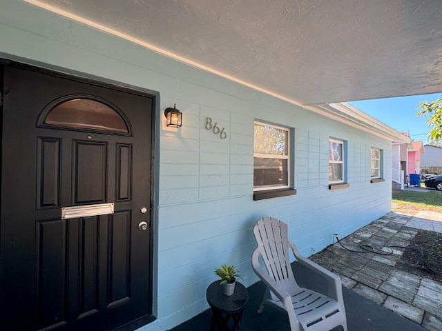 property entrance with covered porch