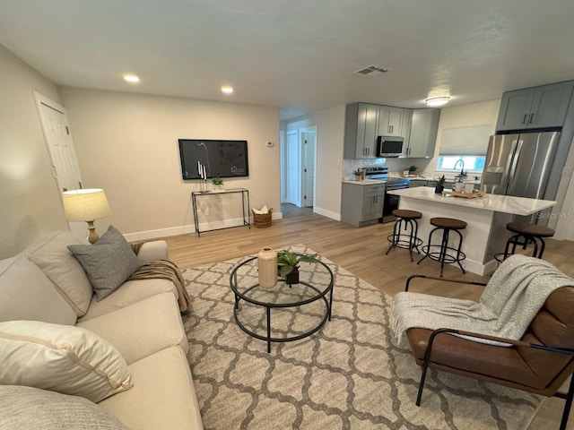 living room featuring light wood-type flooring