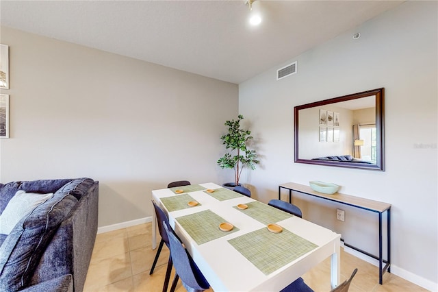 dining area featuring light tile patterned floors