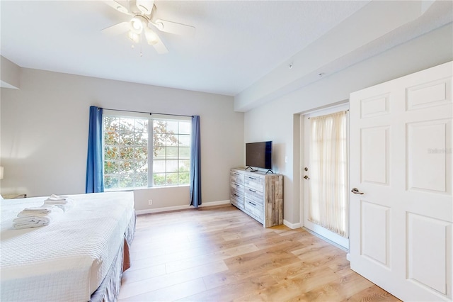 bedroom with ceiling fan and light hardwood / wood-style floors